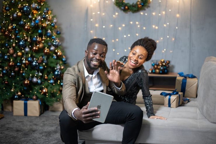 man and woman sitting on the couch